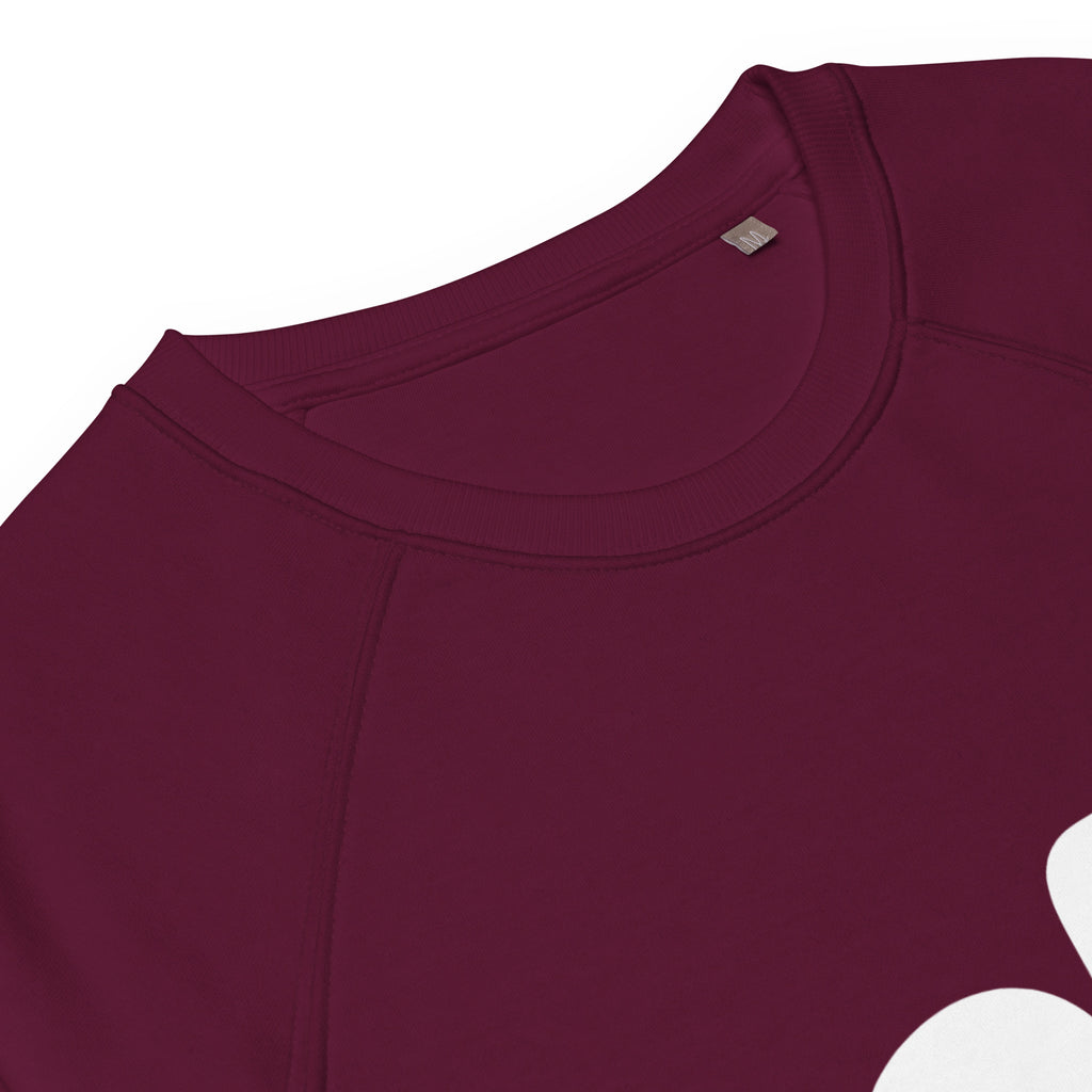 Close-up of a maroon shirt with a brand tag on a white background